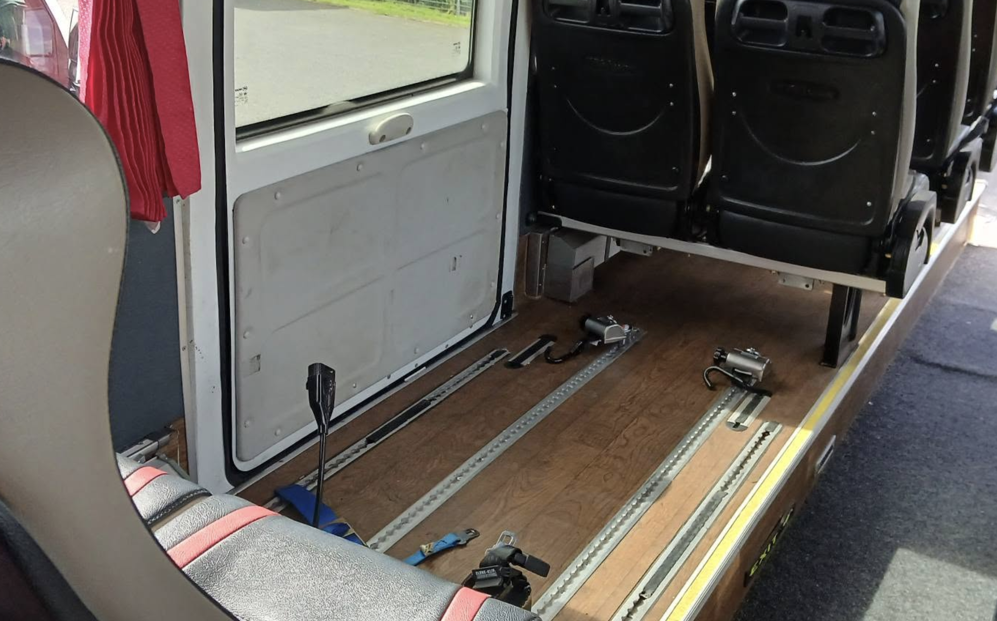 Wheelchair Accessible 4 Interior view of a wheelchair accessible van with seating and track system